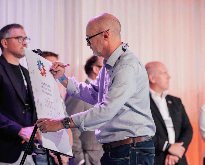 Pledge signing by Colin Nelson at the BSI Innovation Management Summit in London.